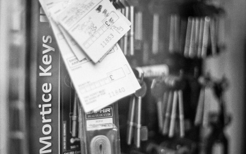 Black and white picture shot on 35mm film of a key maker shop.